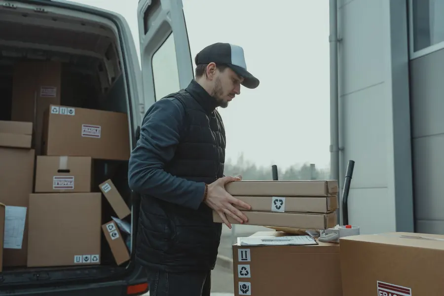 Ghile Trans Logistics van being loaded for a scheduled pallet delivery